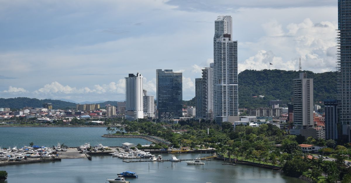 Panama City's modern skyline with marina and lush greenery, a perfect blend of urban and natural beauty.